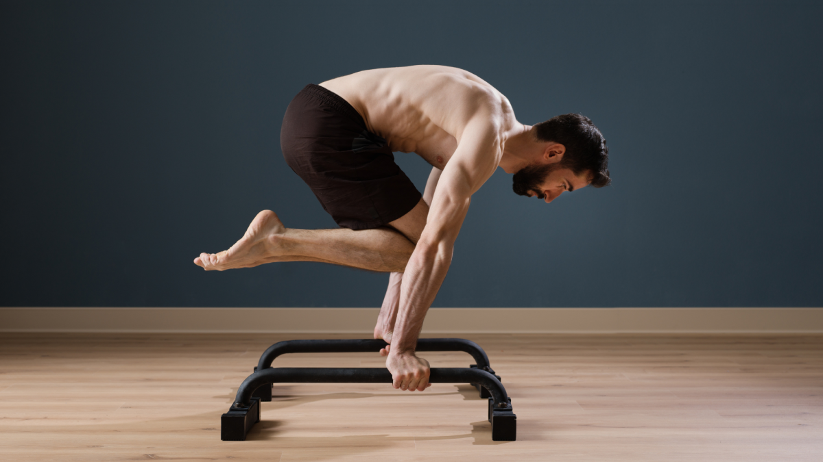 man practicing calisthenics